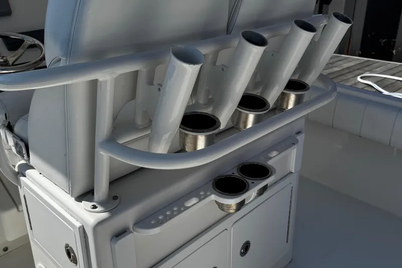 Slide: The Image of 2015 Regulator 28 Forward Seating boat with rod holders and storage compartments. - 15