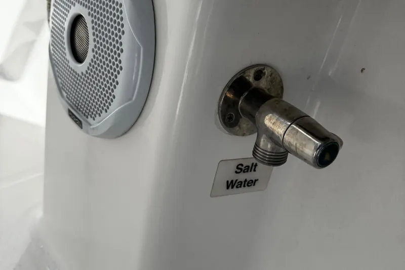 Slide: The Image of Saltwater faucet and speaker on 2015 Regulator 28 Forward Seating boat. - 30