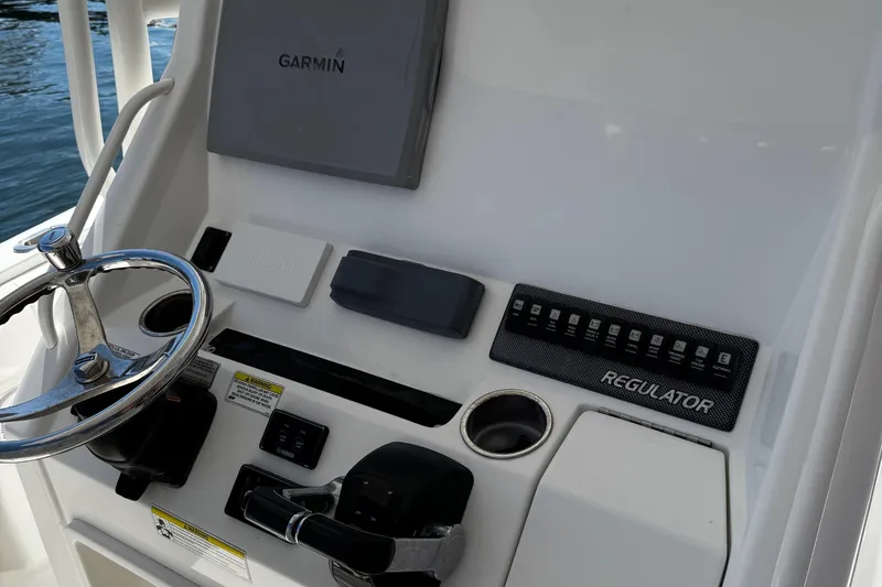 Slide: The Image of 2015 Regulator 28 Forward Seating boat console with Garmin navigation system. - 31