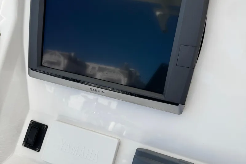 Slide: The Image of Garmin display on 2015 Regulator 28 Forward Seating boat dashboard. - 33