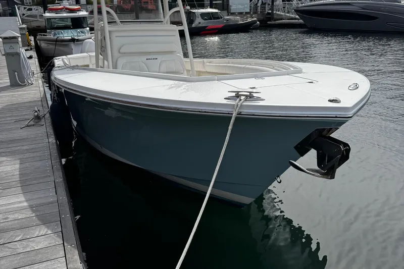 Slide: The Image of 2015 Regulator 28 Forward Seating boat docked at marina. - 39