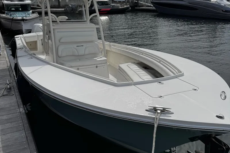 Slide: The Image of 2015 Regulator 28 Forward Seating boat docked at marina. - 4