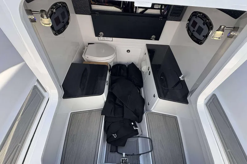 Slide: The Image of Interior of 2026 Monterey 25 Elite boat with toilet and sink. - 11