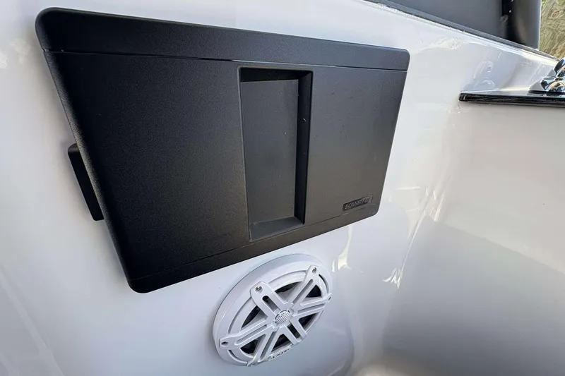 Slide: The Image of 2026 Monterey 25 Elite boat interior with speaker and storage compartment. - 23