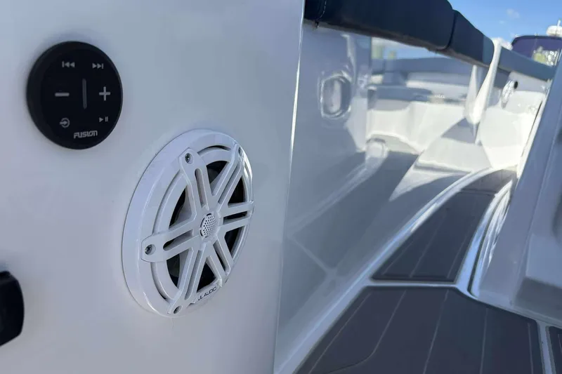 Slide: The Image of 2026 Monterey 25 Elite boat interior with JL Audio speaker and Fusion control panel. - 25