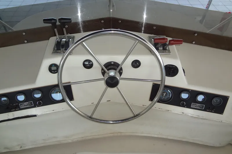 Slide: The Image of Control panel of a 1995 Harbor Master 52 boat with steering wheel and gauges. - 20
