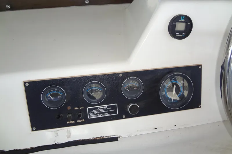 Slide: The Image of Instrument panel of a 1995 Harbor Master 52 boat with gauges and controls. - 21