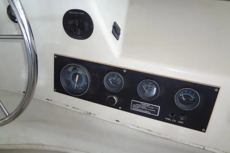 Slide: The Image of Control panel of a 1995 Harbor Master 52 boat with gauges and switches. - 22
