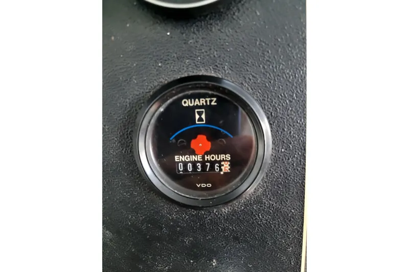 Slide: The Image of Engine hour meter showing 376 hours on 1995 Harbor Master 52 boat. - 26