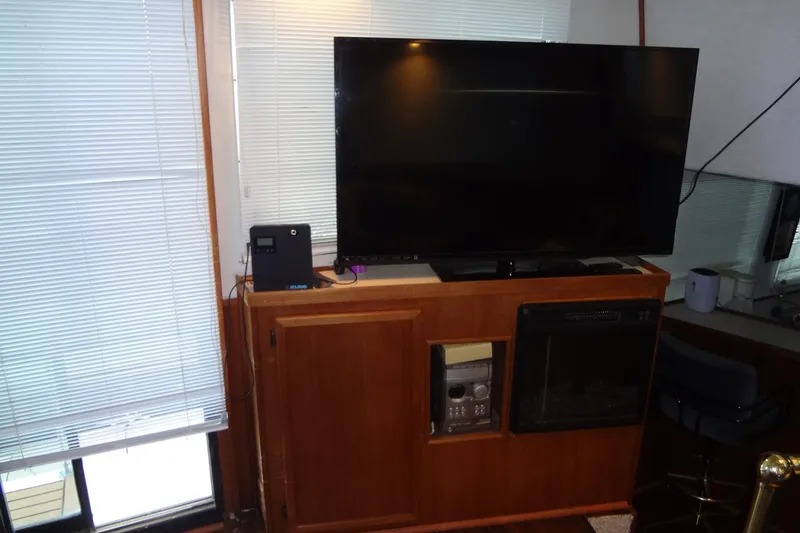 Slide: The Image of Interior of 1995 Harbor Master 52 with TV and wooden cabinet setup. - 30