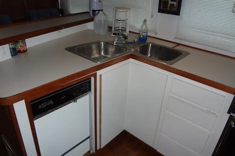 Slide: The Image of 1995 Harbor Master 52 kitchen with dual sinks, dishwasher, and countertop appliances. - 32