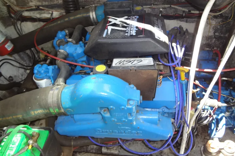 Slide: The Image of Engine compartment of a 1995 Harbor Master 52, featuring a Crusader engine. - 47