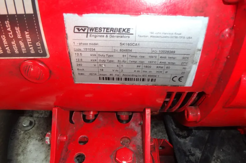 Slide: The Image of Red Westerbeke engine label with specifications, Harbor Master 52, 1995 model. - 50
