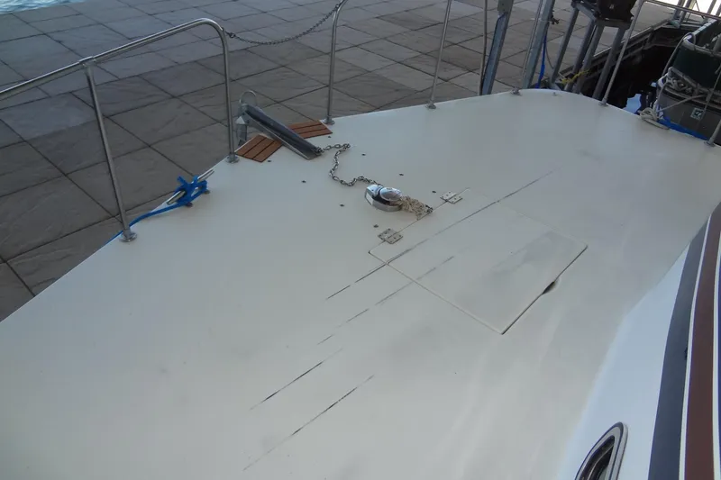 Slide: The Image of Deck of 1995 Harbor Master 52 boat with anchor chain and railing. - 8