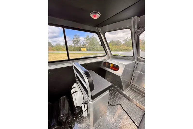 Slide: The Image of Interior of 2018 Stanley 27 Custom boat with metal seating and windows. - 10