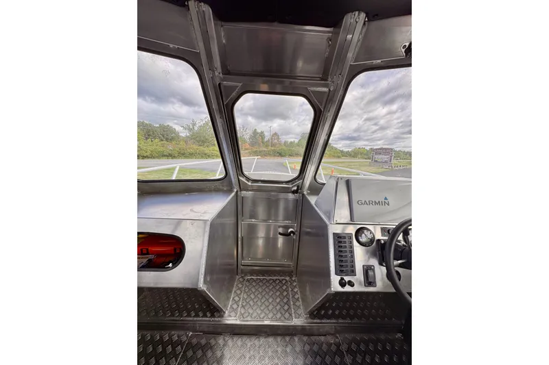 Slide: The Image of Interior view of a 2018 Stanley 27 Custom boat cockpit with Garmin navigation system. - 11