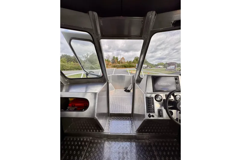 Slide: The Image of Interior view of 2018 Stanley 27 Custom boat cockpit with Garmin navigation system. - 12