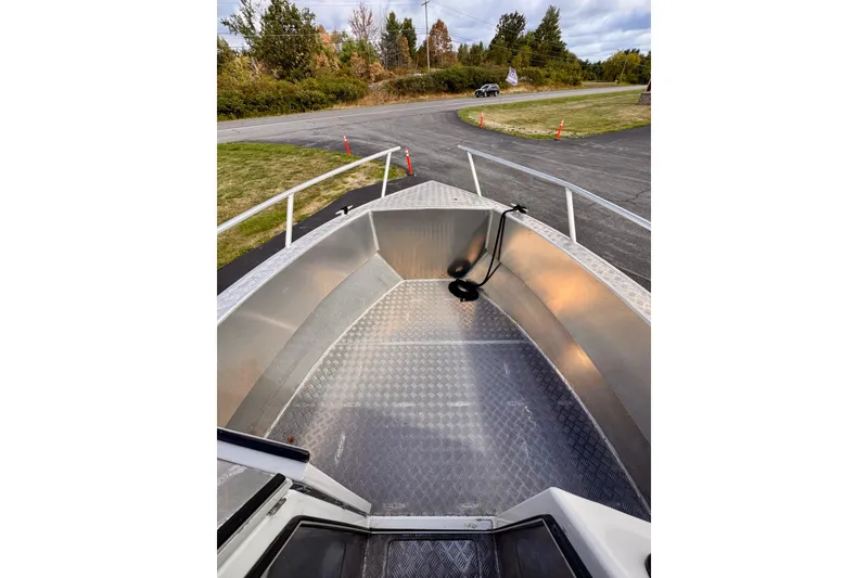 Slide: The Image of Aluminum deck of 2018 Stanley 27 Custom boat, parked on a paved road. - 13
