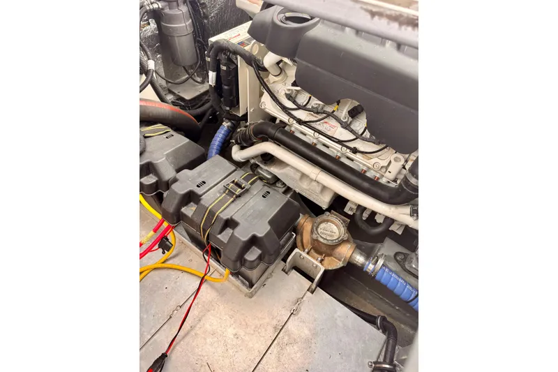 Slide: The Image of Engine compartment of a 2018 Stanley 27 Custom boat, featuring battery setup and wiring. - 17