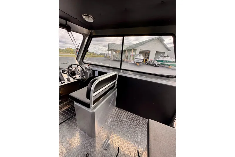Slide: The Image of Interior of 2018 Stanley 27 Custom boat with steering wheel and dashboard view. - 7