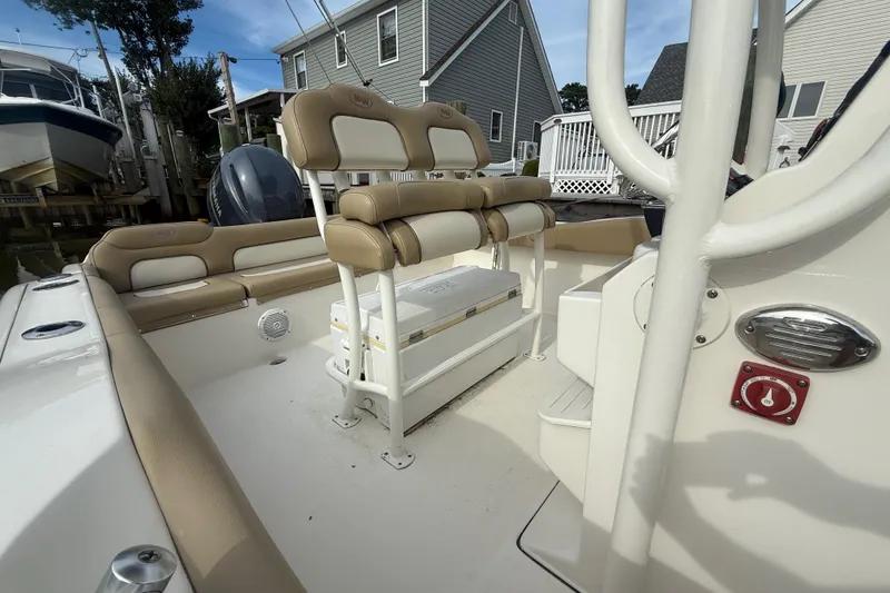Slide: The Image of 2018 Key West 219 FS boat interior with tan seating and white deck. - 12