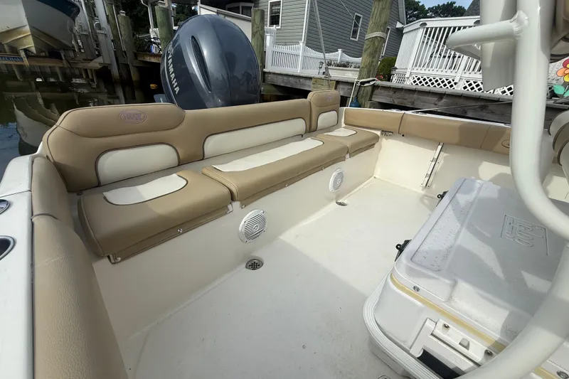Slide: The Image of 2018 Key West 219 FS boat interior with beige seating and Yamaha outboard motor. - 15