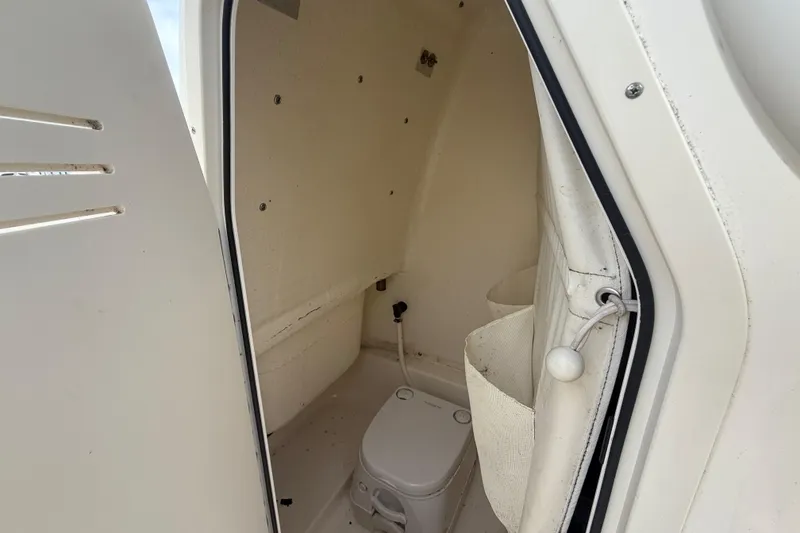 Slide: The Image of 2018 Key West 219 FS boat interior with compact marine toilet. - 20