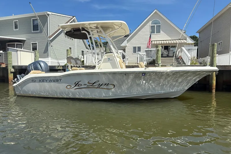 Slide: The Image of 2018 Key West 219 FS boat docked near waterfront homes. - 29