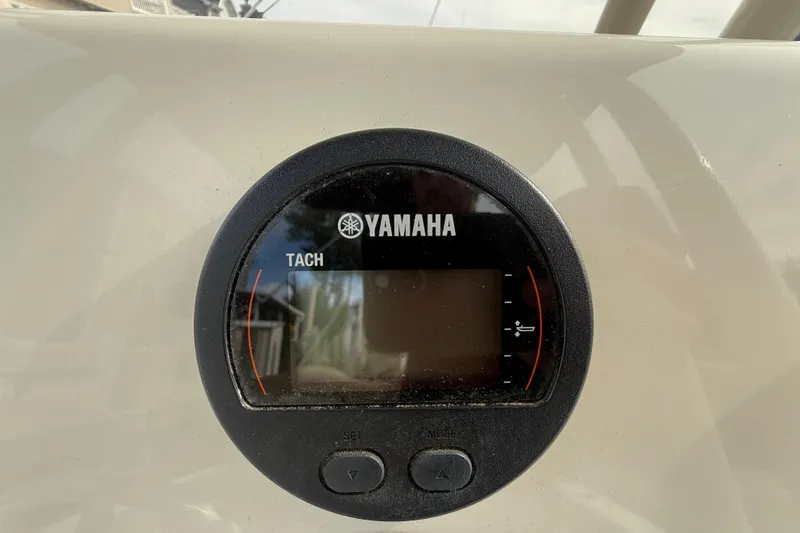 Slide: The Image of Yamaha tachometer on 2018 Key West 219 FS boat dashboard. - 38
