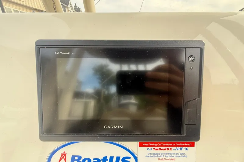Slide: The Image of Garmin GPSMAP X5 on 2018 Key West 219 FS boat dashboard with BoatUS sticker. - 39