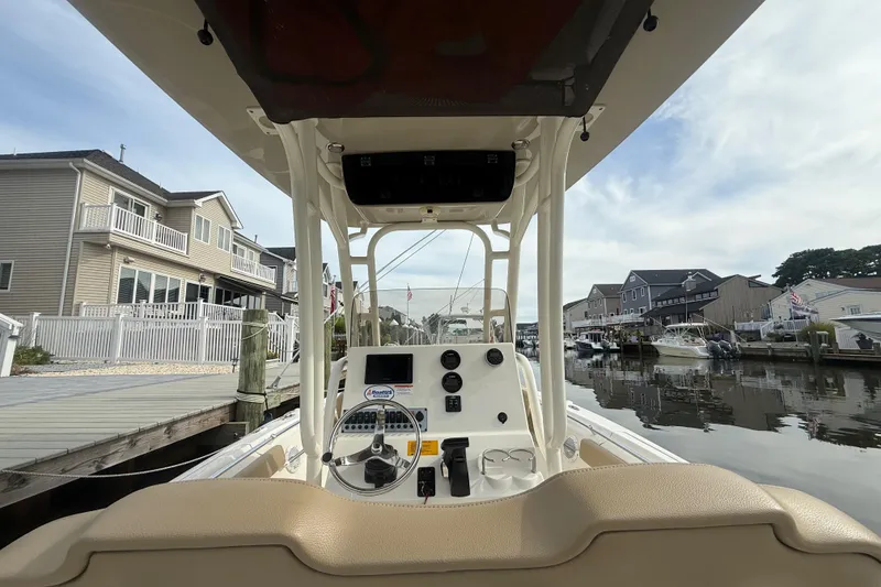 Slide: The Image of 2018 Key West 219 FS boat docked in a residential canal setting. - 41