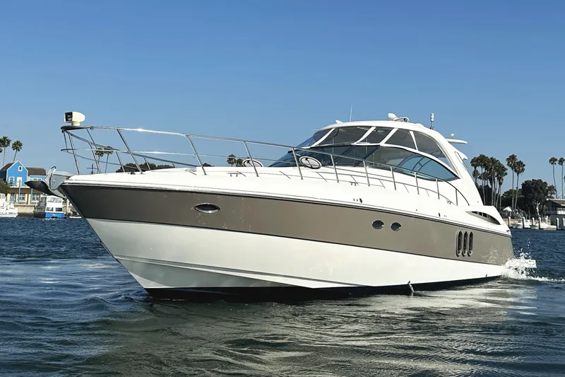 Slide: The Image of 2007 Cruisers Yachts 540 Express on water, showcasing sleek design and luxury features. - 10