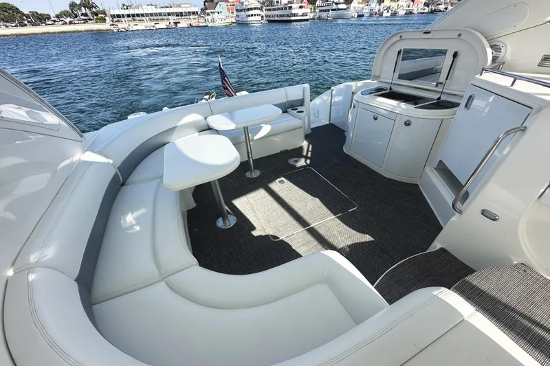 Slide: The Image of 2007 Cruisers Yachts 540 Express with elegant seating and kitchenette on deck. - 17