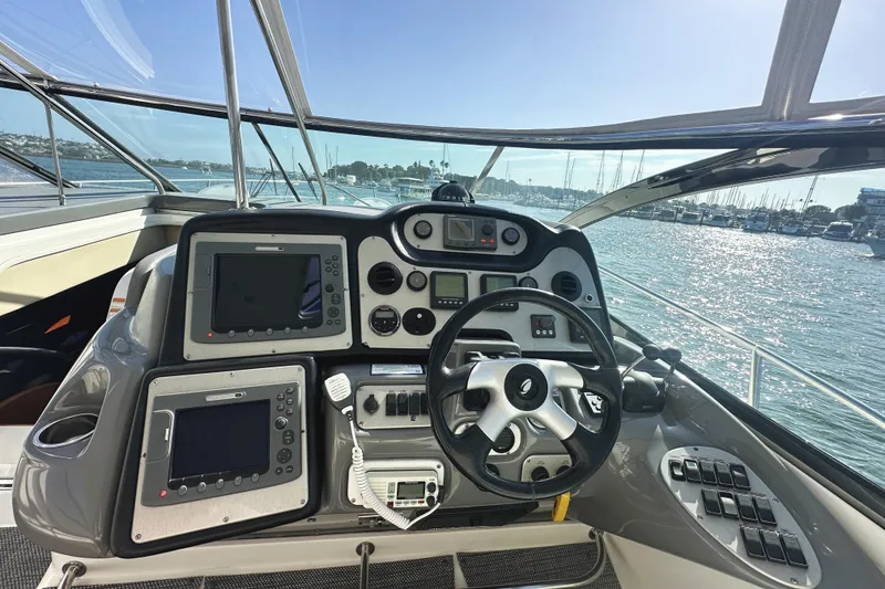 Slide: The Image of Cockpit of 2007 Cruisers Yachts 540 Express with navigation equipment and steering wheel. - 23