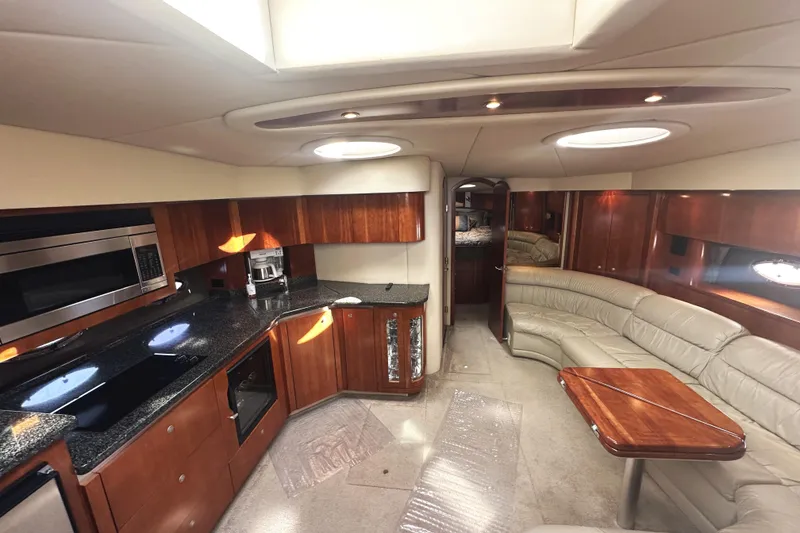 Slide: The Image of Luxurious interior of 2007 Cruisers Yachts 540 Express with modern kitchen and seating area. - 24