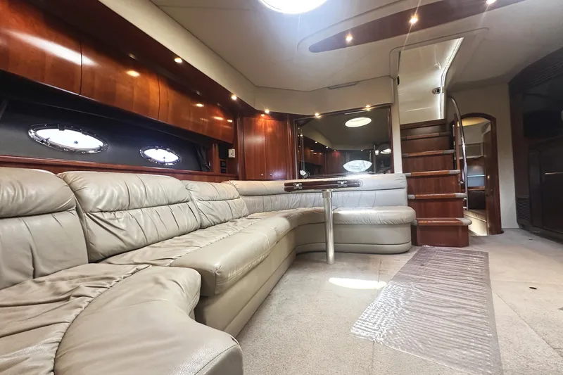 Slide: The Image of Luxurious interior of 2007 Cruisers Yachts 540 Express with leather seating and wooden accents. - 26