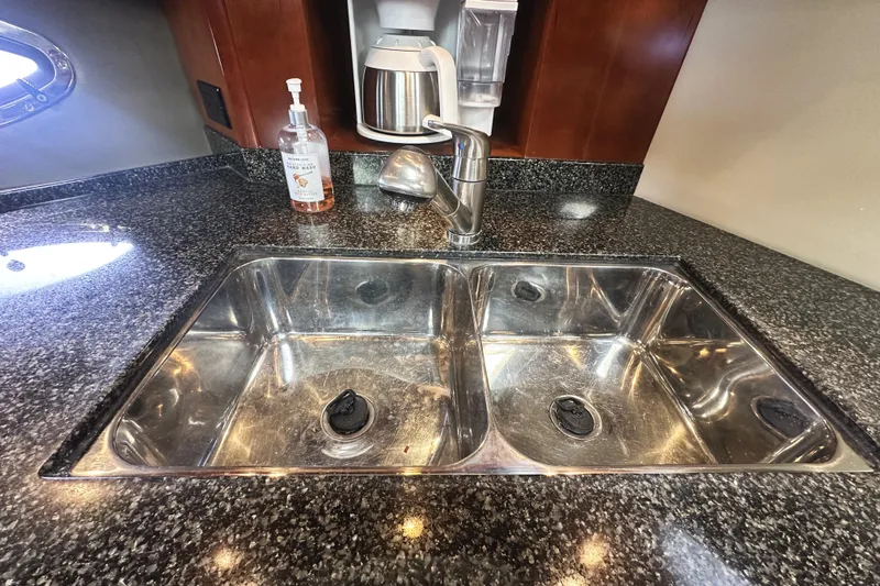 Slide: The Image of Stainless steel double sink in 2007 Cruisers Yachts 540 Express kitchen. - 32