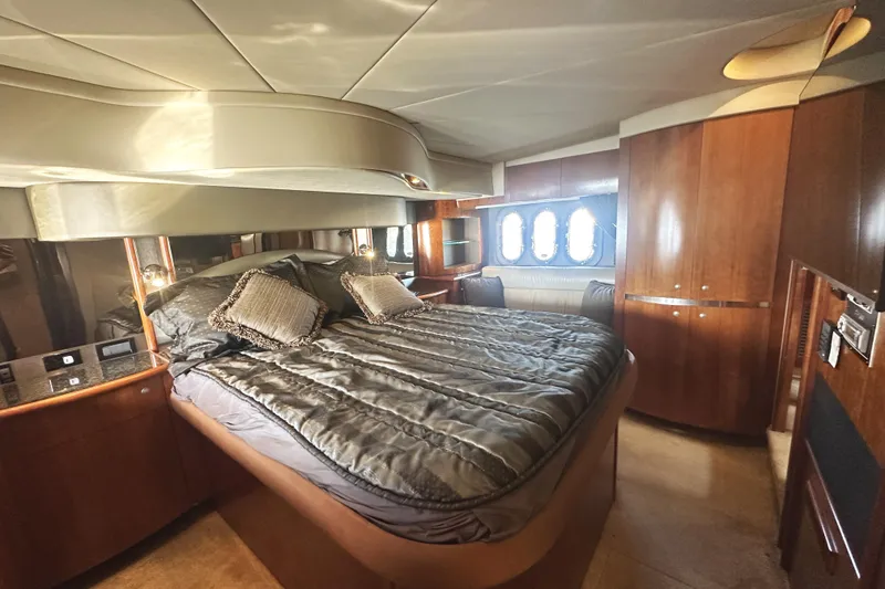 Slide: The Image of Luxurious bedroom interior of 2007 Cruisers Yachts 540 Express with elegant wood finishes. - 34