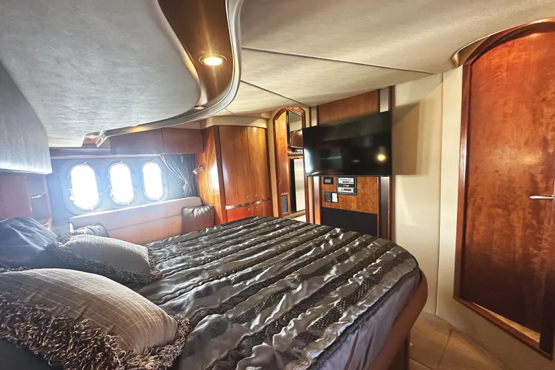 Slide: The Image of Luxurious bedroom interior of 2007 Cruisers Yachts 540 Express with elegant wood finishes. - 37