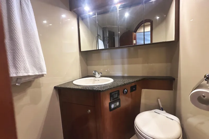 Slide: The Image of Luxurious bathroom in 2007 Cruisers Yachts 540 Express with modern fixtures and elegant design. - 39