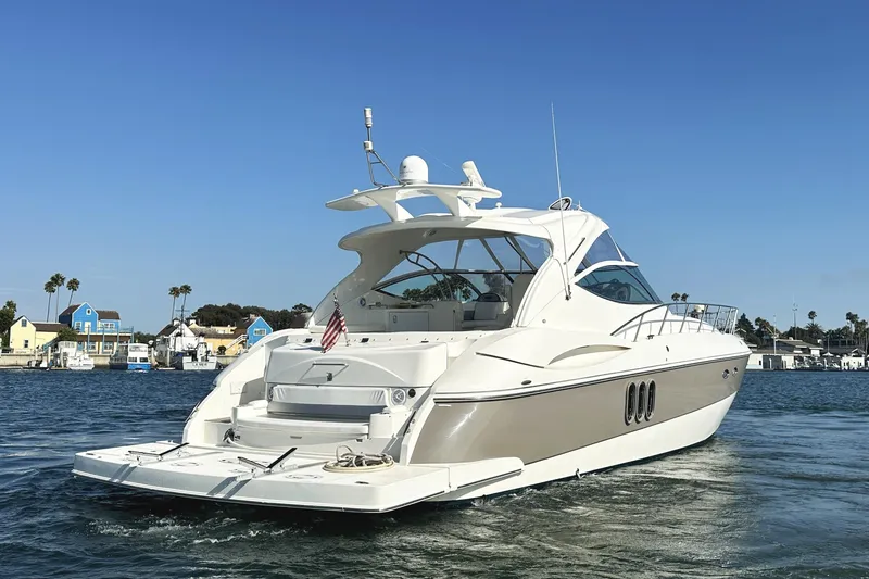 Slide: The Image of 2007 Cruisers Yachts 540 Express on water, showcasing sleek design and luxury features. - 4