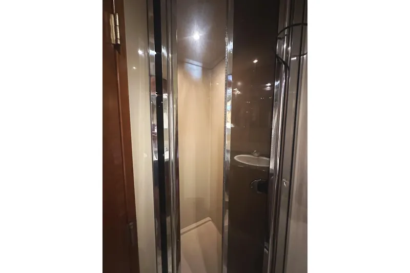 Slide: The Image of 2007 Cruisers Yachts 540 Express bathroom with modern shower and sleek design. - 40