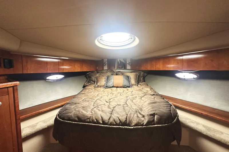 Slide: The Image of Luxurious cabin interior of 2007 Cruisers Yachts 540 Express with cozy bedding. - 42