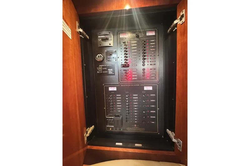 Slide: The Image of Electrical control panel inside 2007 Cruisers Yachts 540 Express, featuring switches and indicators. - 47