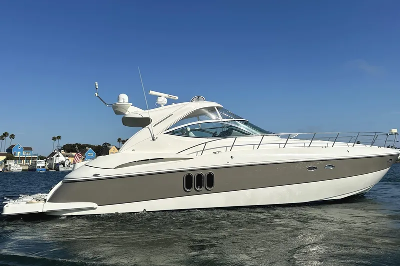 Slide: The Image of 2007 Cruisers Yachts 540 Express on water, clear sky background. - 6