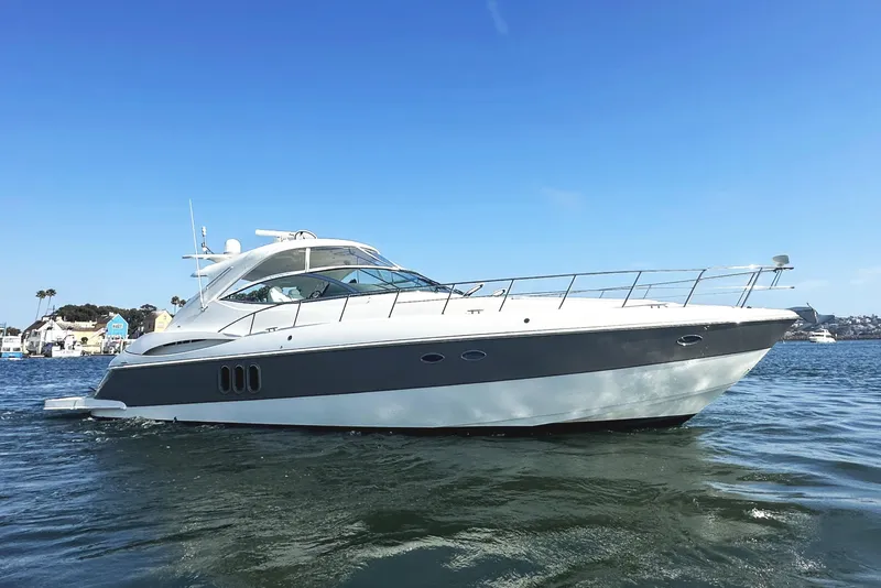 Slide: The Image of 2007 Cruisers Yachts 540 Express on water, showcasing sleek design and luxury features. - 7