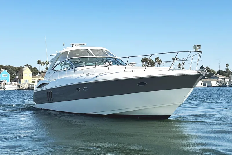 Slide: The Image of 2007 Cruisers Yachts 540 Express on water, showcasing sleek design and luxury features. - 8