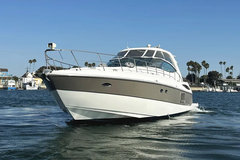 Slide: The Image of 2007 Cruisers Yachts 540 Express on water, showcasing sleek design and luxury features. - 9