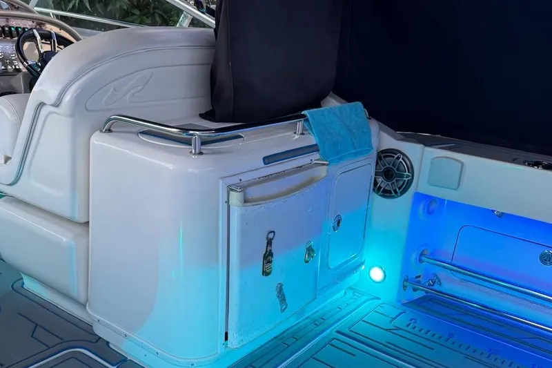 Slide: The Image of 2006 Sea Ray 290 Amberjack boat with canopy, speakers, and colorful lights. - 11