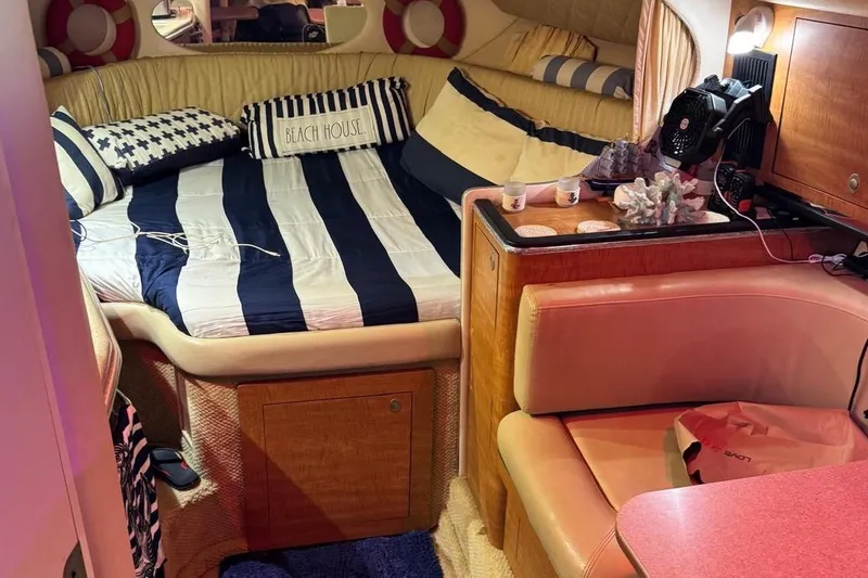 Slide: The Image of 2006 Sea Ray 290 Amberjack boat bathroom with white toilet and sink. - 16